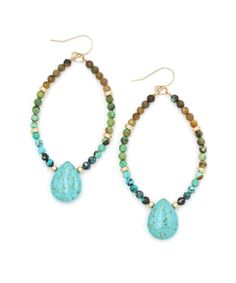 "A favorite for their vibrant boho vibes, the new Laguna Beaded Hoops are handmade from an ombre array of African Turquoise and Magnesite. Gold elements are high quality 14k Gold Fill that will not fade or change color. MATERIALS African Turquoise | Turquoise Magnesite |14k Gold Filled ear wirers and accents MEASUREMENTS 2.5\" drop from ear | 1.5\" wide  ORIGIN Handcrafted in Florida, USA STYLE LAGE03 Receive 15% off your next order, preview new releases and gain early access to sales when you sign up for our VIP list here >> https://bit.ly/VIPpureindigo or at pureindigodesign.com PACKAGING | GIFT OPTIONS »Your jewelry will arrive in a gift box tied with a pretty bow, ready for gift giving »Multiple items may ship in one box, so please specify if you would like a separate box per item »Gif Bohemian Turquoise Hoop Earrings With Natural Stones, Turquoise Teardrop Earrings With Faceted Beads, Turquoise Teardrop Beaded Bohemian Earrings, Bohemian Teardrop Faceted Beads Jewelry, Turquoise Bohemian Beaded Teardrop Earrings, Bohemian Turquoise Teardrop Beaded Earrings, Bohemian Dangle Hoop Earrings With Faceted Beads, Blue Bohemian Hoop Earrings With Natural Stones, Bohemian Blue Hoop Earrings With Natural Stones