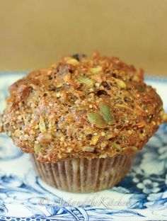 a muffin sitting on top of a blue and white plate