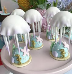 there are some little cakes that look like jellyfishs on top of each other