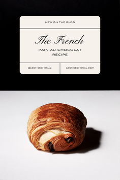 a croissant with the label for the french cafe, pain au chocolat recipe