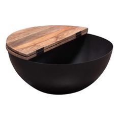 two black bowls with wooden cutting boards in them