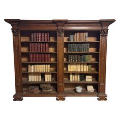 an old wooden bookcase with many books on it's sides and two doors open