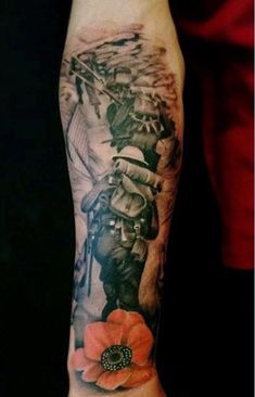 a man's arm with an image of a soldier and flowers on the side