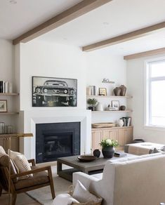 a living room filled with furniture and a fire place