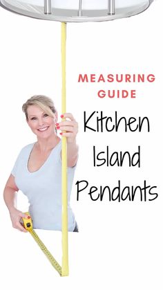 a woman measuring the height of a kitchen island with a tape measure on it's side