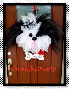 a door hanger with a dog's head and name on the front door