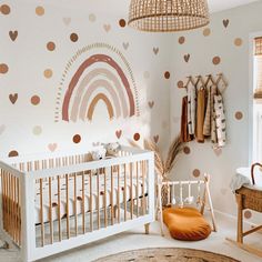 a baby's room decorated in pink, gold and white