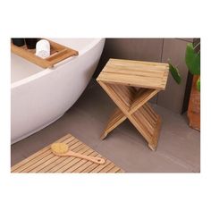 two wooden stools sitting next to a bathtub with a brush on the floor