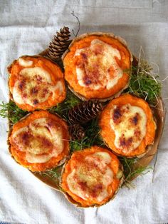 some food is sitting on a plate with pine cones