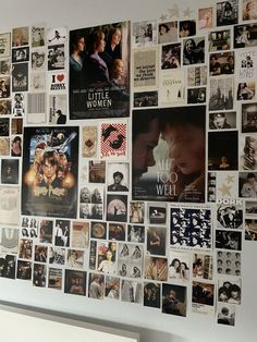 the wall is covered with many different movie posters and movies are on it's sides