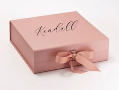 a pink box with a bow and name on it