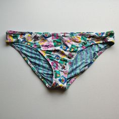 Nwot Vera Bradley Bikini Bottom. White With Red, Pink Yellow, Teal Purple And Green Beach And Travel Themed Stamps. The Inside Pattern Is Squiggly Lines In Green And Blue. Size Xl Based On Typical Measurements, Tag Is Cut In Half Waist: 19 Rise: 9.5 Retro Stretch Swimwear For Summer, Retro Stretch Swimwear For Poolside, Retro Multicolor Stretch Swimwear, Retro Stretch Multicolor Swimwear, Fun White Stretch Swimwear, White Stretch Swimwear For Fun, Retro Printed Stretch Swimwear, Retro Printed Beach Bottoms, Retro White Swimwear For Pool