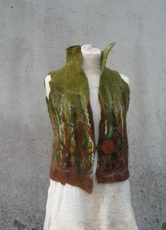 Made to Order Forest woodland merino felted waistcoat MADE TO ORDER Beautiful olive green and chocolate brown, with silk fibers, hand felted onto muslin cotton... Perfect for wrapping up warm and stylishly on these wintery days! It has an elegantly high collar and handmade wooden button. I will, of course, accept orders for a similar color and patterned vest as shown, though it must be remembered that each garment is individually unique and as such, no two are or will ever be, exactly the same. Green Winter Vest With Buttons, Fitted Green Vest Outerwear, Sleeveless Buttoned Vest For Costume, Fitted Vest For Cosplay In Fall, Fitted Green Vest For Fall, Girl Punk, Nuno Felt, Pixies Fairies, Festival Jacket