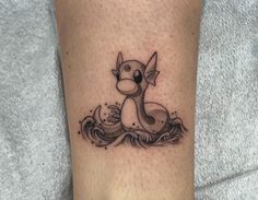 a tattoo on the leg of a person