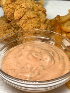 fried chicken and fries are served with dipping sauce