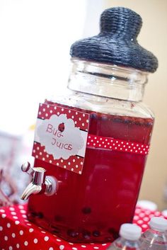 a jar filled with liquid sitting on top of a table