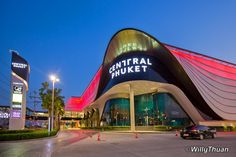 the central shuket building is lit up with red and blue lights at night