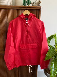 "1980s Nylon Red USA Made Pullover Windbreaker  Lightweight nylon material. One very small snag on the front under the pocket. No stains, or holes. Zippers work great. Fits like a men's small or women's medium (please check measurements!). MEASUREMENTS: armpit to armpit (chest): 20.5\" shoulder to shoulder: 17\" sleeve length: 24.5\" collar to hem (length): 27.5\"" Red Windbreaker With Pockets For Outdoor Activities, Red Retro Windbreaker With Pockets, Retro Red Windbreaker With Pockets, Pullover Windbreaker, Guys Be Like, Pullover Jacket, Favorite Outfit, Gender Neutral, Bathing Beauties