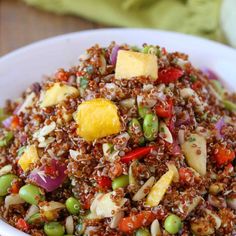 a white bowl filled with rice and vegetables