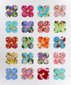 a quilt with many different flowers on it