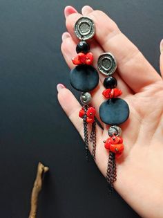 Beautiful very long earrings, created from various materials in red and black: red coral, black agate, resin elements, aluminum chain. The earrings are important and eye-catching, but at the same time they are light and comfortable to wear. The contrast between black and red make these earrings very elegant, very beautiful in summer with a low-cut dress. They recall the sea, the sun... for those who love nature. A beautiful gift for her. All jewels are delivered in a decorated box, ready to be g Handmade Red Long Drop Jewelry, Modern Black Long Drop Jewelry, Black Dangle Jewelry With Adjustable Chain, Modern Red Metal Jewelry, Handmade Red Pendant Earrings, Nickel-free Black Long Drop Jewelry, Handmade Black Long Drop Earrings, Black Bohemian Long Drop Earrings, Handmade Red Coral Dangle Earrings