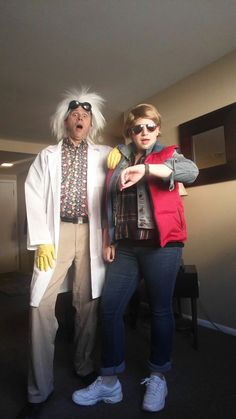 two people dressed up as characters from the movie back to the future standing next to each other