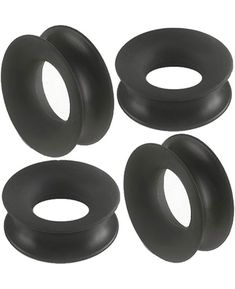 four black rubber o - rings on a white background