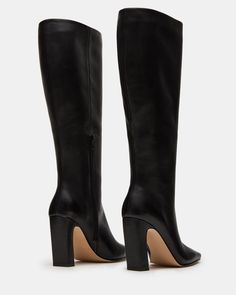 Expertly constructed, the LIZETTE boot is designed with a sleek knee-high silhouette, square toe, and stylish heel. This boot is durable and fashionable, making it the perfect addition to any wardrobe. Elevate your look with these timeless boots. 3.5 inch heel height Size 6 measurements: 16.5 inch shaft circumference, 14.25 inch shaft height Size 8 measurements: 17.25 inch shaft circumference, 14.75 inch shaft height Size 10 measurements: 18 inch shaft circumference, 15.25 inch shaft height Leat Wide Calf Knee High Boots, Timeless Boots, Stylish Heels, Shoe Fits, Wide Calf, 5 Inch Heels, Elevate Your Look, Sweaters Knitwear, Knee High