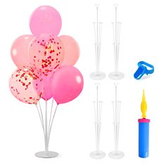 a bunch of balloons and some candles on a white background