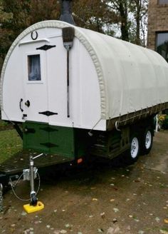 the trailer is parked on the side of the road