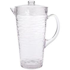 a glass pitcher with a lid and handle on the bottom, sitting in front of a white background