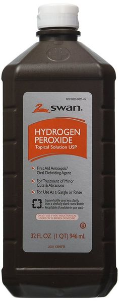 a bottle of hydrogen peroxide on a white background with an orange and black label