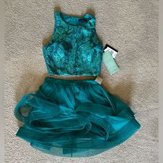 Perfect For Prom, Formal, Or For A Wedding Guest. Beautiful Teal Turquoise Color. Features Sequined Crop Top With Light Padding In The Bust Area. Top Is Fitted And Has A Full Length Zipper Up The Back. Skirt Is Full, Many Layers Of Tulle, Each Layer Has The Lower 2 Inches With More Structure To Keep The Shape. Skirt Has Zipper With Hook And Eye Closure To Keep It Secure. Very Whimsical Design. Brand Is City Triangles From Jc Penney And Retails For $139. This Is A Stunning Set. Will Ship Quickly! Area Top, Tiered Tulle Skirt, Back Skirt, Sequin Crop Top, Teal Turquoise, Prom Formal, Whimsical Design, Turquoise Color, Triangles