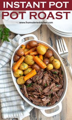 a pot roast with potatoes and carrots in it on a wooden table next to a fork