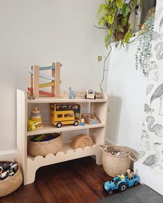 there is a shelf with toys on it in the room