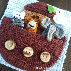 a crocheted bag with animals in it