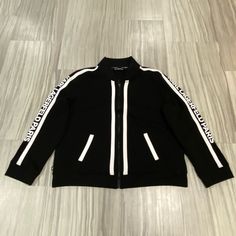 Karl Lagerfeld Paris Is Considered An Athletic And Leisure Jacket. This Is In Great Condition And Well Sought After. It Can Be Unisex. Dimensions: 23” Across Chest 24” Long 22.5” Length For Sleeves Long Sleeve Outerwear With Signature Stripes For Streetwear, Casual Outerwear With Signature Stripes For Streetwear, Casual Streetwear Outerwear With Signature Stripes, Winter Sporty Track Jacket With Signature Stripes, Sporty Track Jacket With Signature Stripes For Winter, Casual Track Jacket With Signature Stripes For Winter, Fall Streetwear Outerwear With Signature Stripes, White Sporty Outerwear With Ribbed Cuffs, Athleisure Jacket