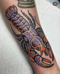 a colorful crab tattoo on the arm