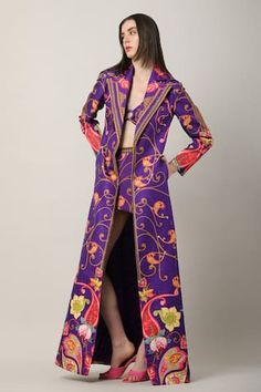 Multicolor floor length jacket with paisley, floral print and notched lapel collared neckline.
Components: 1
Pattern: Printed
Type Of Work: Paisley, floral
Neckline: Notched lapel collar
Sleeve Type: Full sleeves
Fabric: Sheeted Satin Blend
Color: Multi Color
Other Details: 
Side pockets
Note: Inner jumpsuit, bralette and skirt worn by the model is not for sale
Occasion: Party - Aza Fashions Floor Length Jacket, Statement Jacket, Paisley Floral, Jacket For Women, Full Sleeves, Print Jacket, Jackets Online, Lapel Collar, Coloring Sheets