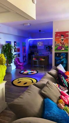 a living room filled with lots of furniture and colorful rugs on the floor next to each other