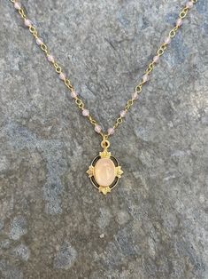 This vintage-inspired necklace is handmade using a 2mm genuine rose quartz wire-wrapped chain and a 12x17mm pendant with an authentic 6x8mm rose quartz stone.  This necklace is hypoallergenic. (Cadium free, lead free, and nickel safe)  Rose quartz is a gemstone that promotes love and emotional healing. Please note that each stone is unique and varies in color. The necklace comes in a ribbon-wrapped box and is ready to be gifted. If you would like to leave a note for the recipient, you can do so Gold Crystal Necklace With Rose Quartz Gemstone, Gold Rose Quartz Gemstone Crystal Necklace, Gold Rose Quartz Crystal Necklace, Handmade Gold Crystal Necklace With Rose Quartz, Gold Wire Wrapped Rose Quartz Jewelry, Elegant Pink Wire Wrapped Crystal Necklace, Gold Rose Quartz Wire Wrapped Necklace, Gold Wire Wrapped Rose Quartz Necklace, Gold Wire-wrapped Rose Quartz Necklace