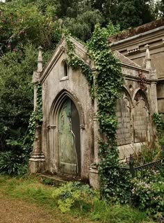 an old cemetery with ivy growing on it's walls and door in the middle