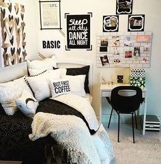 a bedroom with black and white decor on the walls