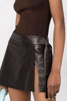 Gladiator Leather Kilt Looking for a kilt with modern, urban edge? The Gladiator Leather Kilt is sure to suit your tastes and is made with modern day warriors in mind. The kilt is made from genuine leather that is of the absolute finest quality to give it a luxurious texture. With its wrap front style, the kilt has an asymmetrical hemline, which is embellished with an embroidered blue lion. On the right side, a patch pocket with exposed zipper adds to the cool biker-inspired look of the design. Leather Wrap Skirt, The Gladiator, Leather Kilt, Black Watch Tartan, Kilt Skirt, Scottish Kilts, Blue Lion, Fantasy Closet, Tartan Fabric