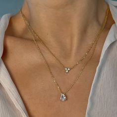 Opt for elegance with our water drop charm necklace. The water drop charm is delicate and feminine, making this piece ideal for layering and creating a bohemian-chic look. CZ gemstones with 18k premium triple plated gold stainless steel. So luminous that it rivals the stars.  Details:  18K Vermeil Premium Stainless Ste Elegant Crystal Necklaces For Layering, Dainty Cubic Zirconia Drop Necklace, Gold Teardrop Crystal Necklace With Adjustable Chain, Delicate Teardrop Cubic Zirconia Jewelry With Chain, Gold Teardrop Crystal Necklaces With Adjustable Chain, Dainty Teardrop Cubic Zirconia Drop Necklace, Dainty Teardrop Pendant Necklace For Layering, Dainty Cubic Zirconia Teardrop Necklace, Elegant Gold Crystal Necklaces For Layering