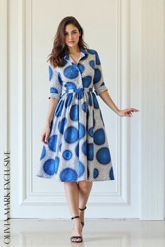 Olivia Mark - Elegant Polka Dot Midi Dress with Blue Floral Accents - A Fashionable and Flattering Choice Polka Dot Midi Dress, Flared Skirt, Cinched Waist, Blue Hues, Fitted Bodice, Strappy Heels, Olivia Mark, Flare Skirt, Timeless Style