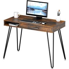 a computer desk with a keyboard and monitor on it, sitting in front of a white background