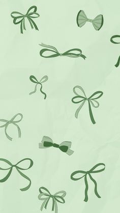 an image of bows and ribbons on the side of a sheet of paper with green ink