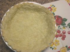 an uncooked pie sitting on top of a table