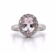 14k White Gold Oval Morganite And White Round Diamond  Ring 3.5 Grams Size 7.25 Round White Brilliant Cut Diamonds 0.2 Carats Total Weight Clarity: SI2-I1H-I 1 Oval Cut Morganite 9.5x6mm This is a stunning 14k white gold morganite and diamond ring. The morganite in this ring has a light pale color. If you have any questions or concerns please message me and I will get back to you as soon as possible. serial number: AJ051254 A Classic Oval Gemstones With Halo Setting, Oval Center Stone Gemstones For Formal Occasions, Oval Gemstones With Halo Setting For Formal Occasions, Oval Brilliant Cut Gemstones For Fine Jewelry, Classic Oval Gemstone With Center Stone, Oval White Gold Gemstones With Brilliant Cut, Classic Oval White Gold Gemstones, Oval White Gold Gemstones With Halo Setting, Oval Yellow Gold Gemstones With Halo Setting